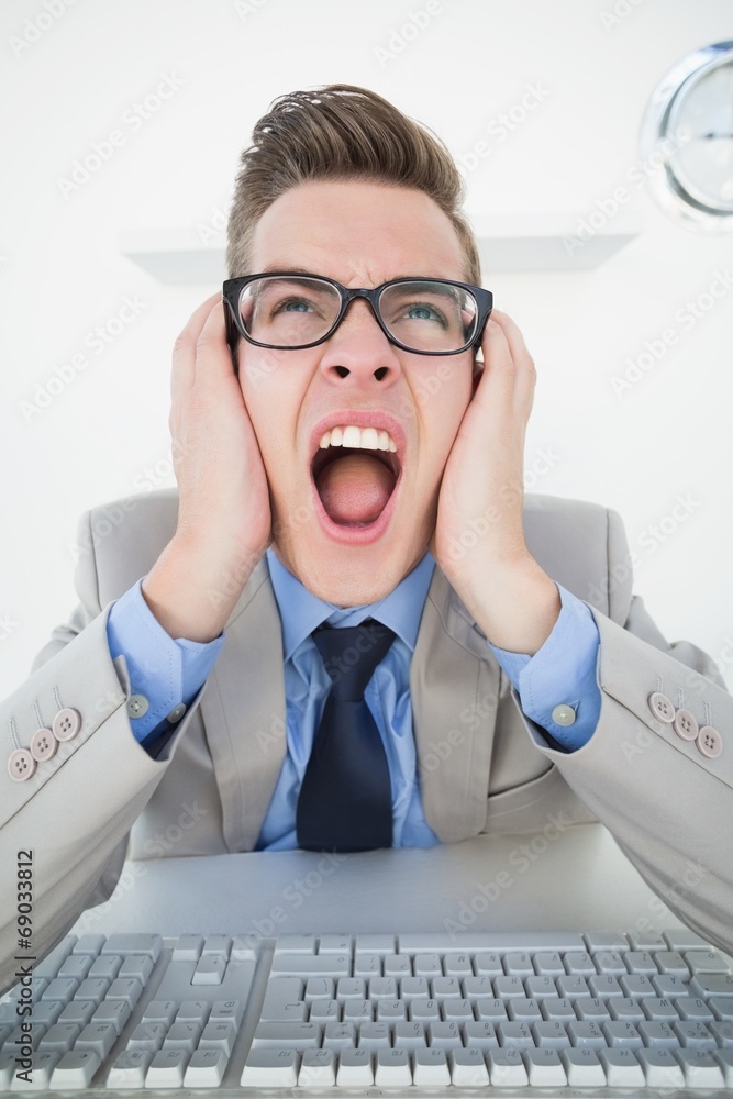 Poster angry businessman working on computer