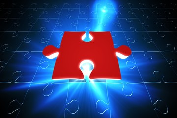 Red jigsaw piece on blue puzzle