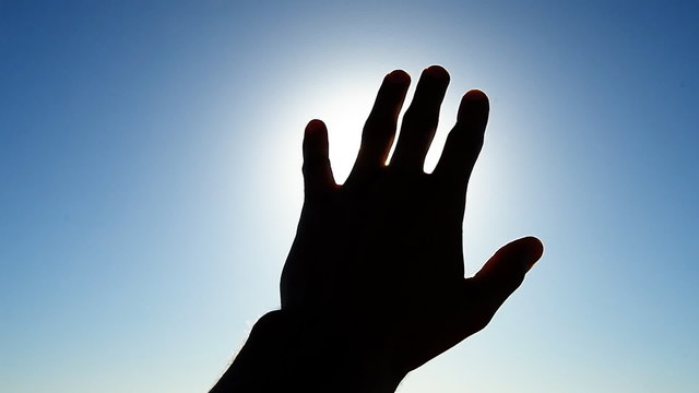 Hand to sun