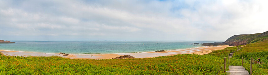 Rough rocky coastal panoramic landscape of Brittany with cloudy