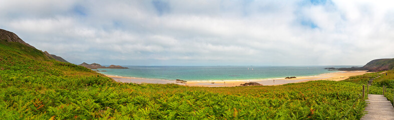 Rough rocky coastal panoramic landscape of Brittany with cloudy