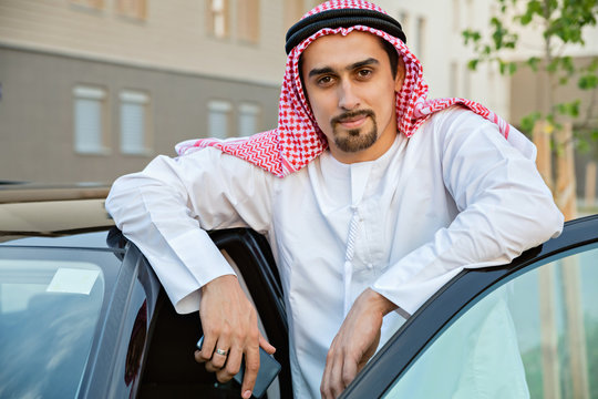 Young Arabian Next To Car