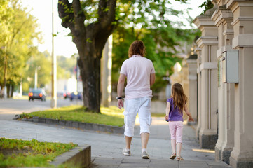 Obraz premium Father and daughter having a walk