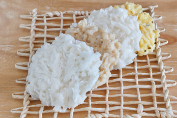 Coconut candy cocada on wooden table