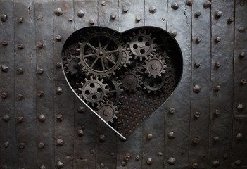 heart hole in old metal with gears and cogs