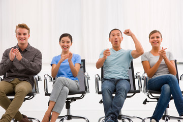 Executives applauding and cheering office