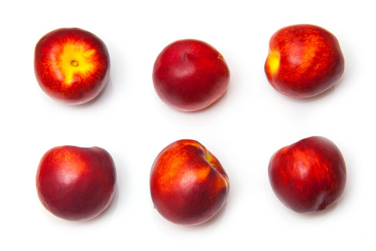 .Nectarines isolated on a white studio background.