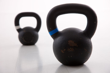 Naklejka na ściany i meble Kettlebells weights in a workout gym