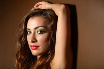 Portrait of beautiful young woman with bright make-up