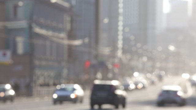 Steam of autos on the street of the big city, out of focus