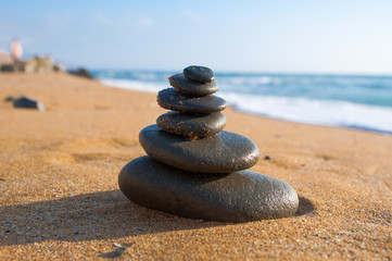 Zen composition on the beach.