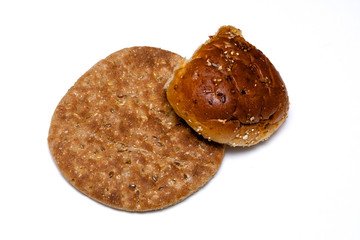 multi grain flat bread with roll on white