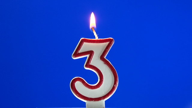 Number 3 - three birthday candle burning