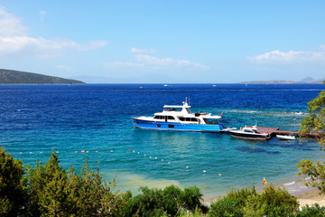 Fototapeta na wymiar Recreation yacht at the pier on Turkish resort, Bodrum, Turkey