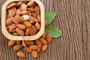 almond seed on wooden bowl
