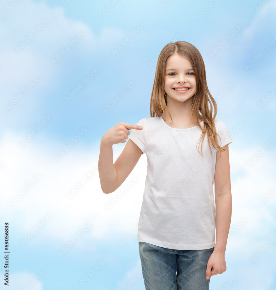 Wall mural smiling little girl in blank white t-shirt