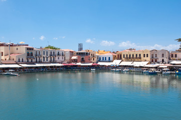 Fototapeta na wymiar The old venetian harbour with restaurants. Crete in Greece.