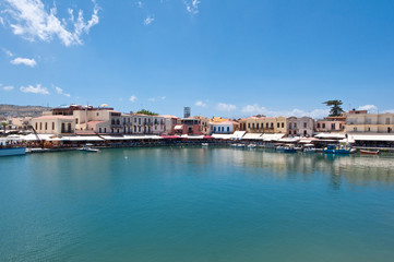 Fototapeta na wymiar The old venetian harbour with restaurants. Crete,Greece.