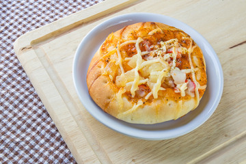 Pizza with crab on table.