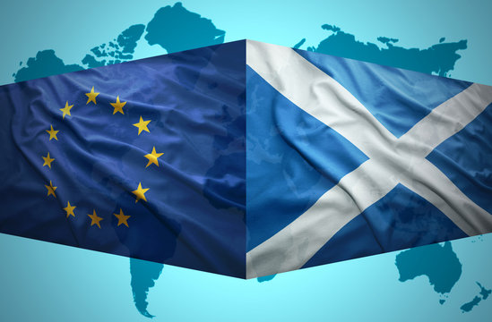 Waving Scottish and European Union flags