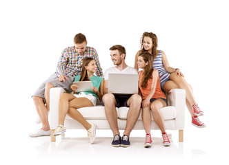 Group of young people on sofa with tablet