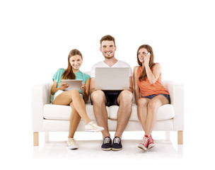Obraz na płótnie Canvas Young people on sofa with laptop