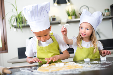 happy children kids family preparing funny cake kitchen at home