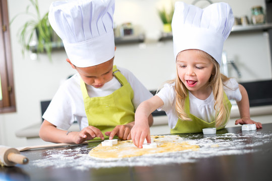 Naklejki happy children kids family preparing funny cake kitchen at home