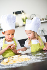 happy children kids family preparing funny cake kitchen at home