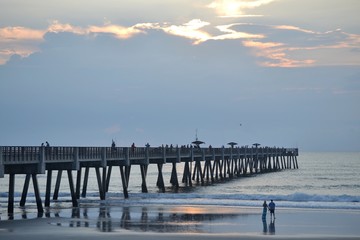 Couple on Beach watching Sunrise