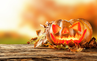 Scary hallowen pumpkin on wood