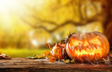 Scary hallowen pumpkins on wood