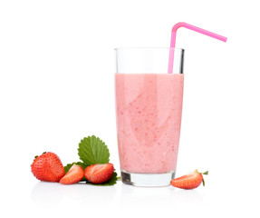 Several sliced strawberries with leaf,juice and straw isolated