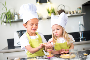 happy children kids family preparing funny cake kitchen at home