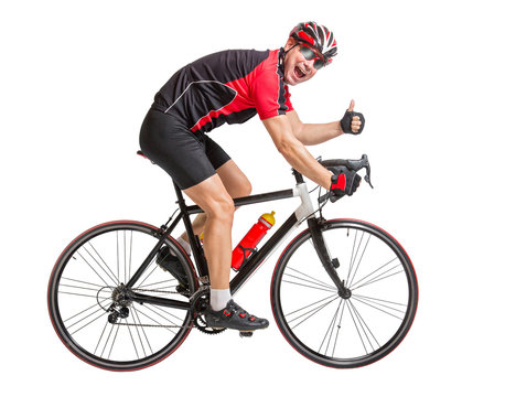 cheerful cyclist with winning gesture riding a bike