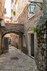 Fototapeta na wymiar narrow streets and old houses in Budva. Montenegro