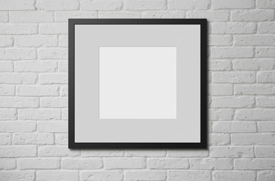 Blank picture frame at the brick wall with copy space and clippi