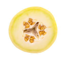 Slice of honeydew fruit over white background 