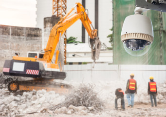Excavator and Workers Working on Construction Site