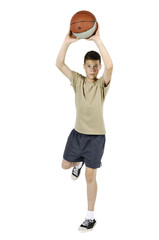 Young man jumping and throwing a ball