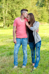 Happy kissing young couple outdoor