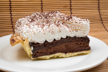 Chocolate Tart with cream and cocoa powder on the top