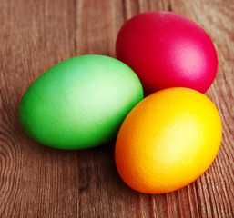Painted Easter Eggs on wooden background