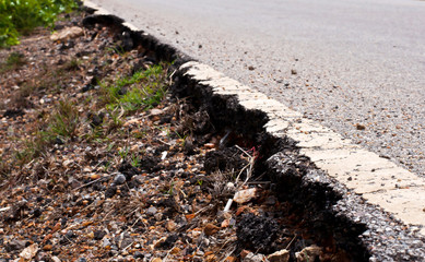 Damaged asphalt road, bad road
