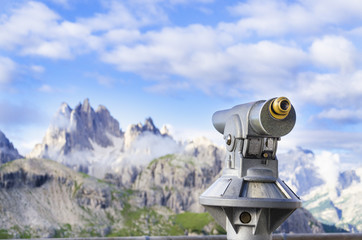 A binoculars with a wonderful view of a Dolomites Mountains
