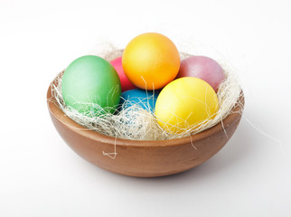 Colorful painted easter eggs in bowl