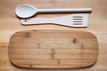 wooden cutlery on cutting board
