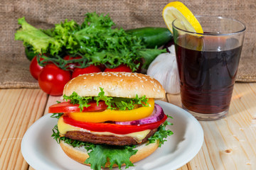 hamburger and drink with slice of lemon