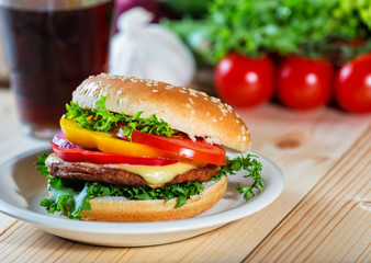 hamburger and drink with slice of lemon