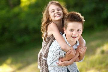 Fototapeta premium Portrait of a boy girl in a summer